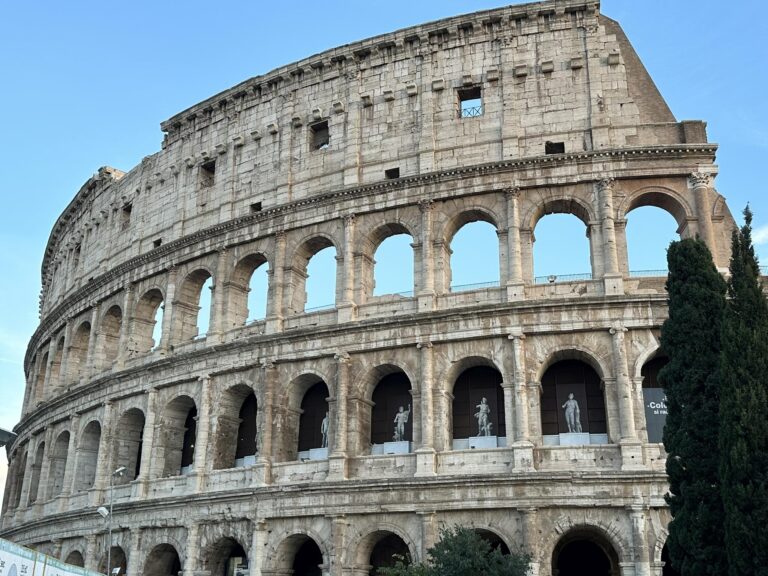 The Colosseum in Rome at golden hour — the iconic starting point for any Rome travel guide